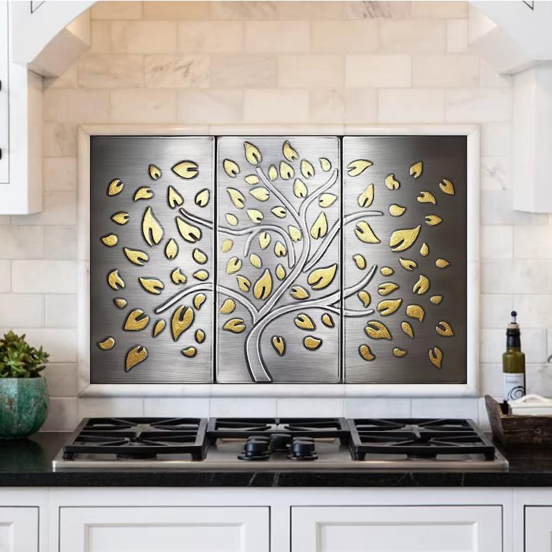 stainless tree with brass falling leaves
